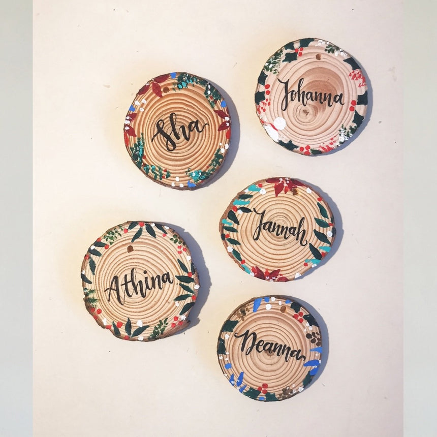 Personalised names painted on Christmas themed wood tags