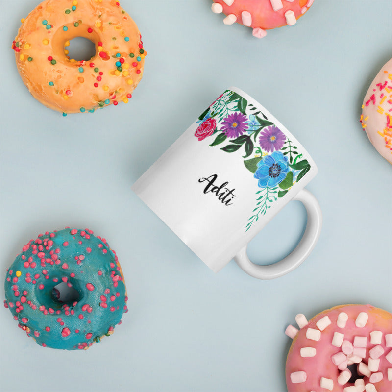 Personalised name with whimsical floral mug design.
