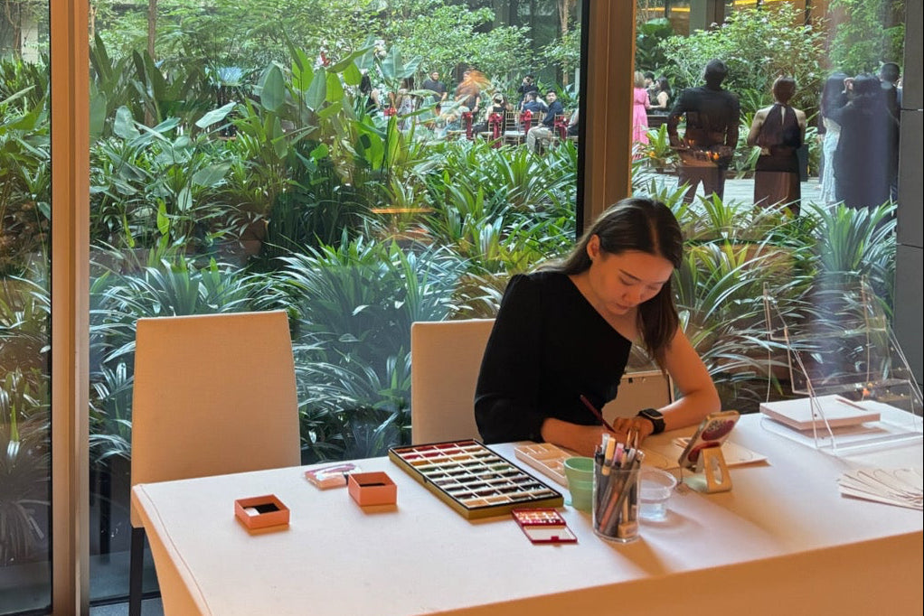 Live sketch artist drawing wedding guests