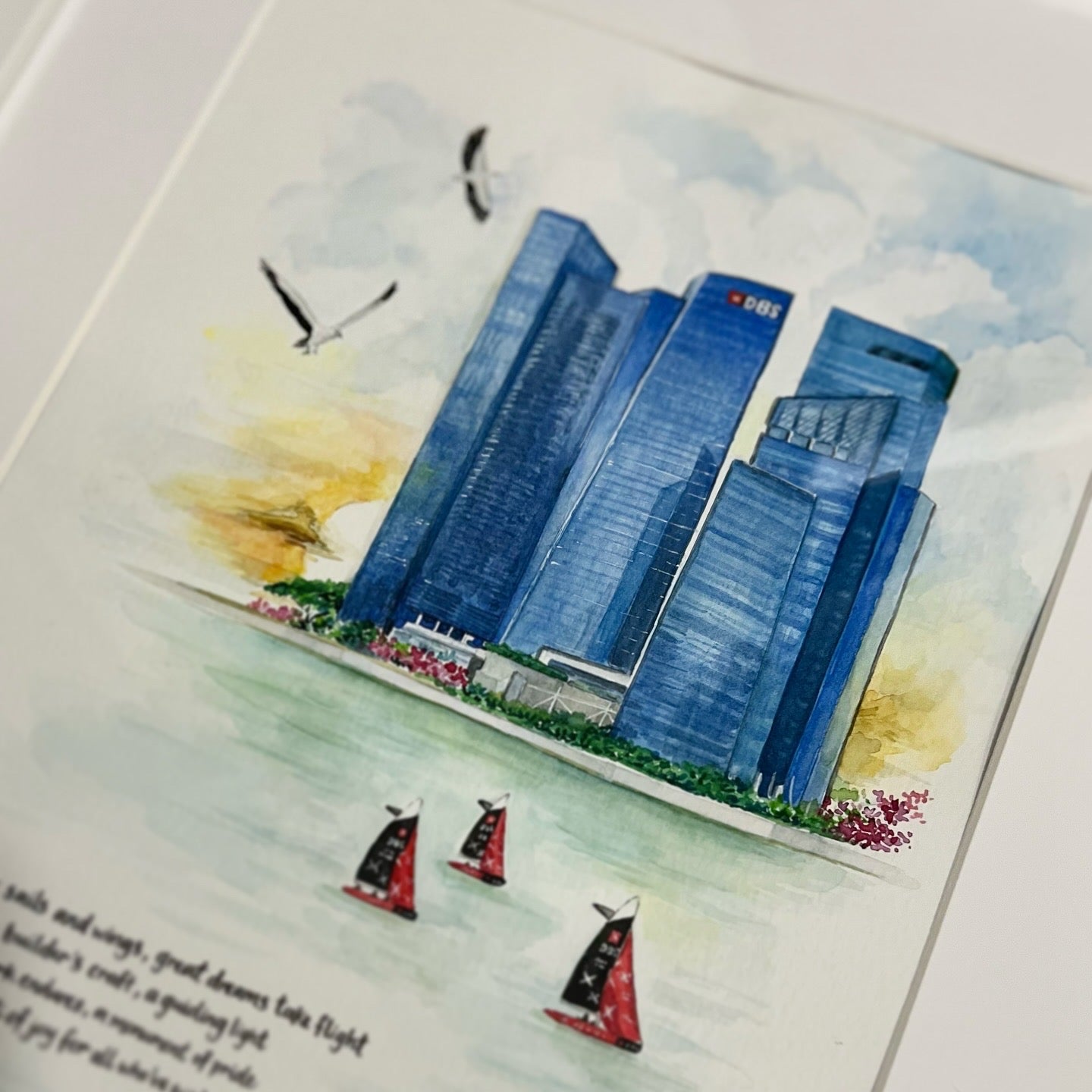 Illustration of skyscrapers with sailboats in the foreground on a watercolor background.
