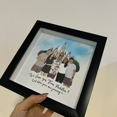 Framed artwork of a family with a hand holding it on a Disney park theme background