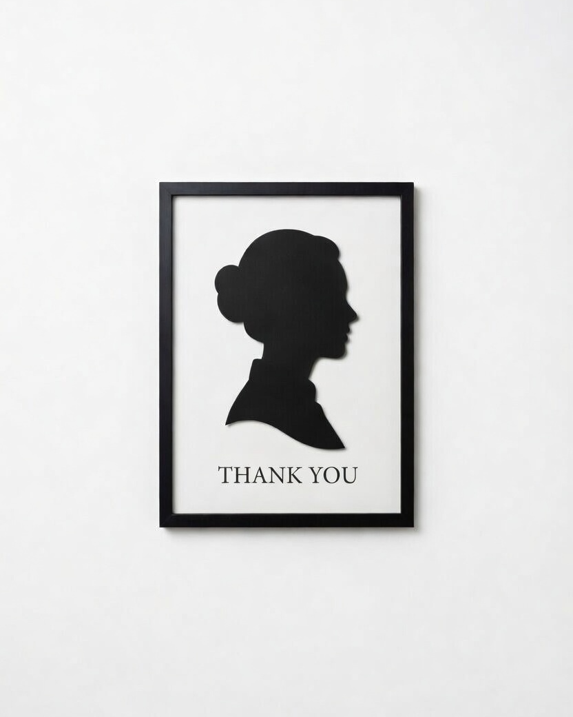 Framed silhouette art print with 'THANK YOU' text on a white wall