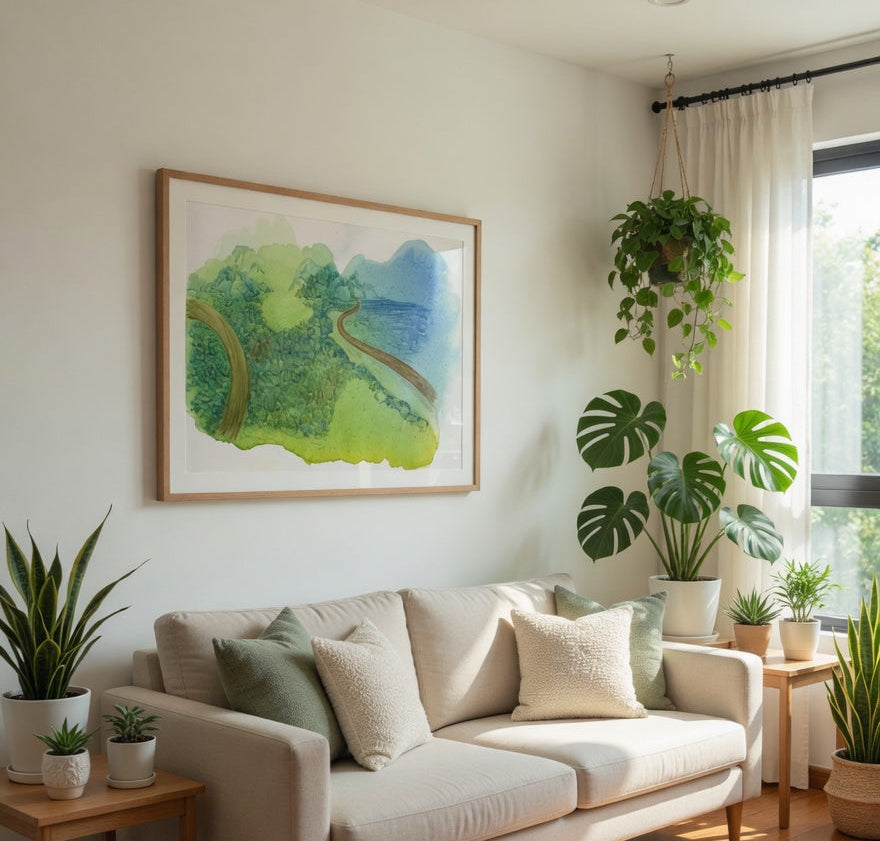 Living room with a beige sofa, potted plants, and a framed landscape painting.