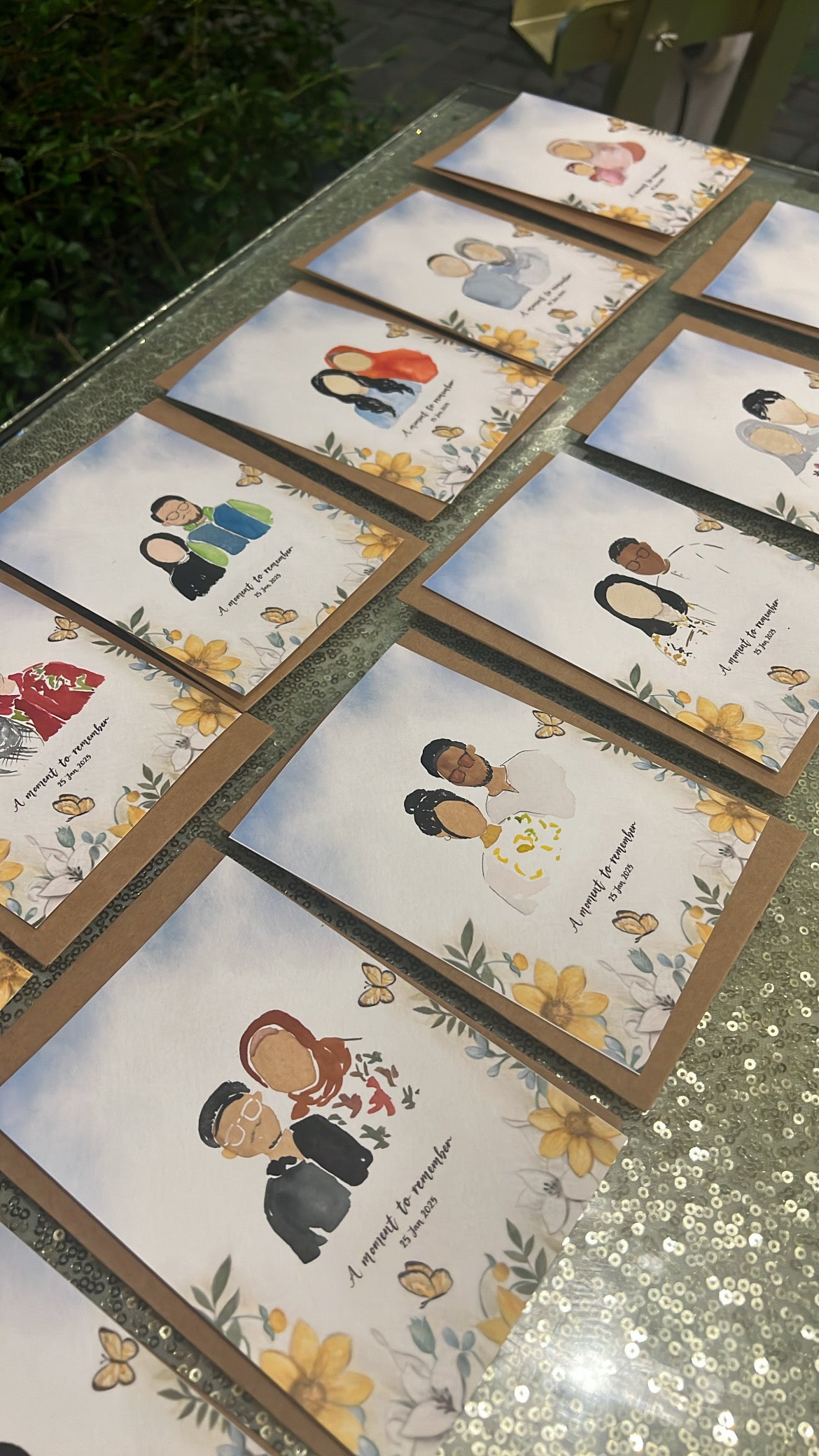 Set of portraits cards with illustrated couples on a reflective surface.