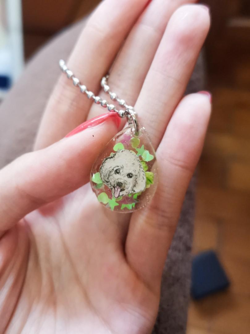 Dog poodle portrait green hearts design keychain in teardrop shape.