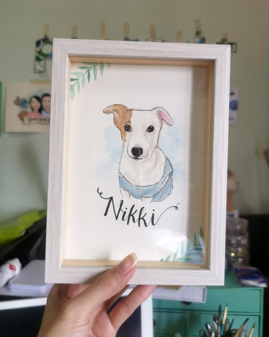 Pet dog watercolor portrait with simple leaf border in a light cream frame.