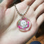 Hamster portrait keychain with pink hearts and a name banner.